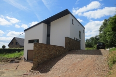 Construction d'une habitation - façade - crépi et moellon