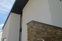 Construction d'une habitation - façade - crépi et moellon